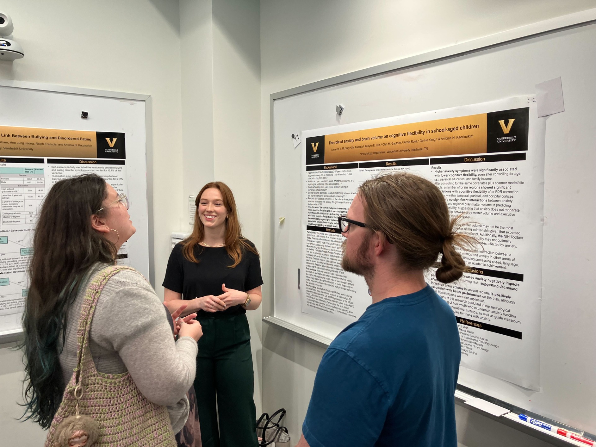 Summer volunteer, Laurenne McCarty, presenting her poster, "The role of anxiety and brain volume on cognitive flexibility in school-aged children".